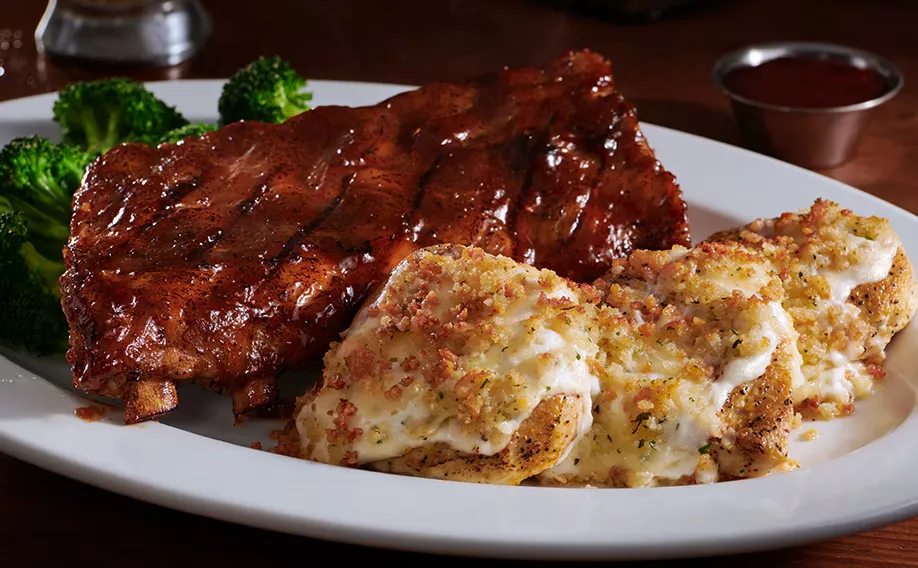 9 oz. Parmesan Crusted Chicken with Half-Rack Baby Back Ribs of Longhorn menu with price and image 